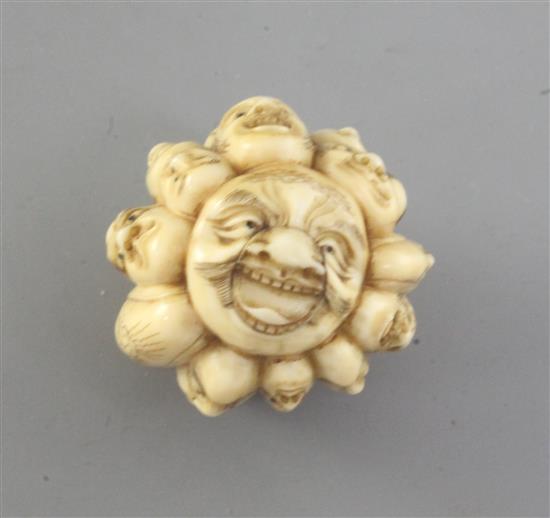 A Japanese ivory multi mask okimono, 19th century, 3.7cm (no. 521)